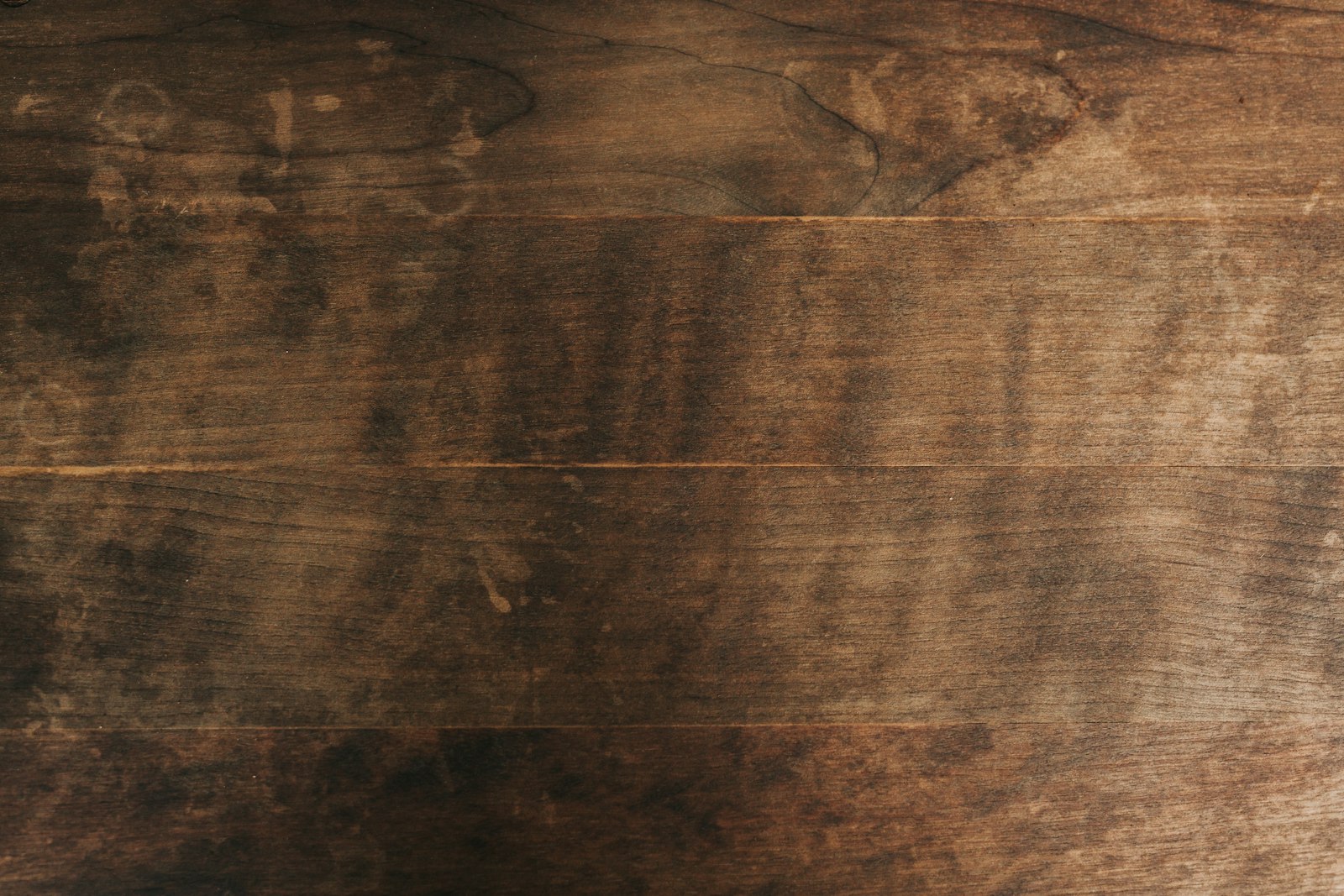 Rich dark wood grain texture, representative of the weather-proof materials used in our outdoor cabinetry